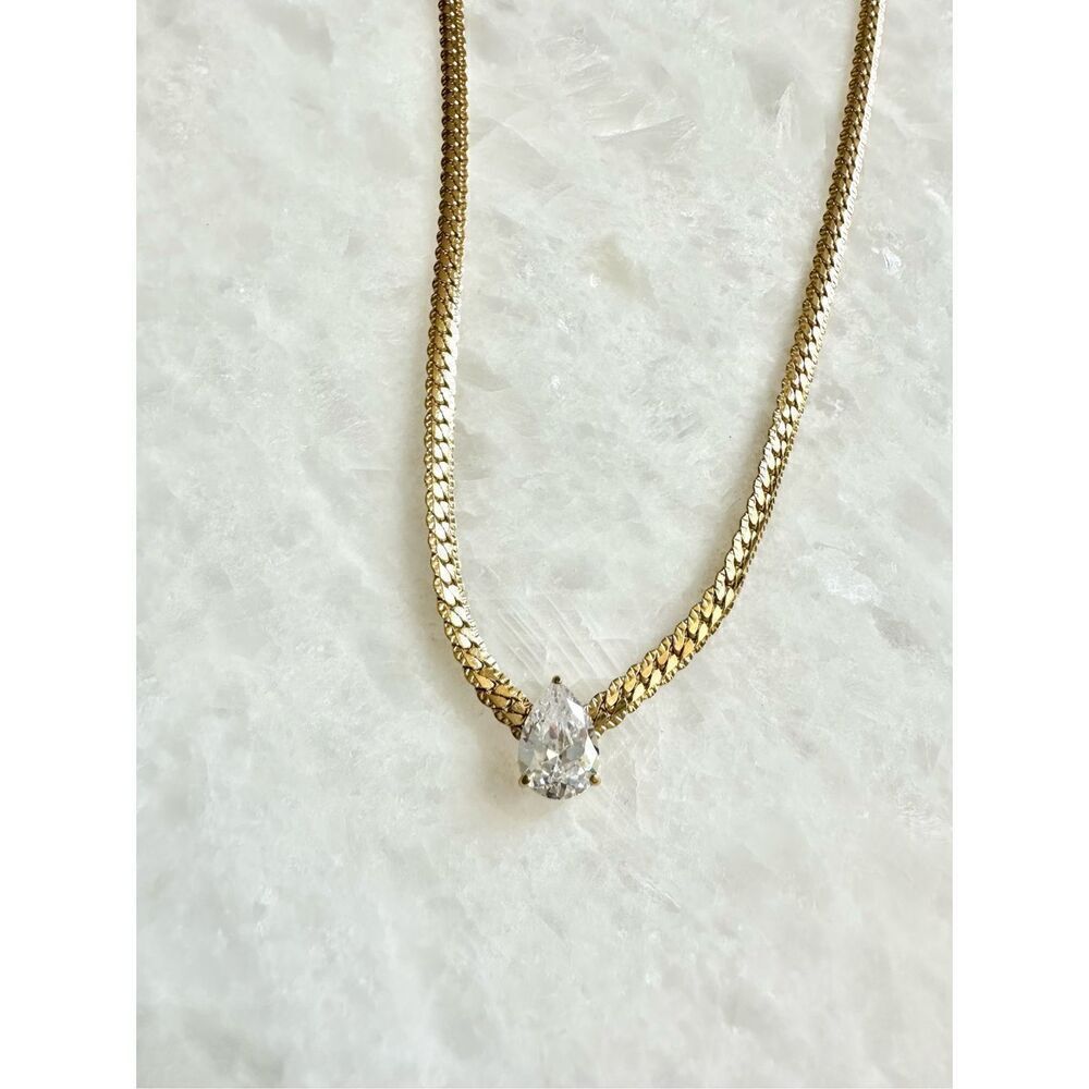 Gold flat chain mod style necklace with pear cut cubic zirconia